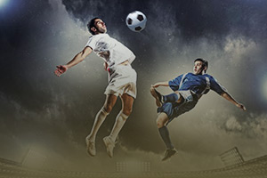 Two players compete for the ball during a football match